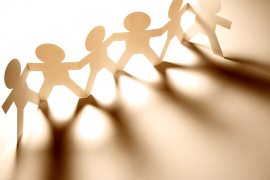 Team holding hands united together