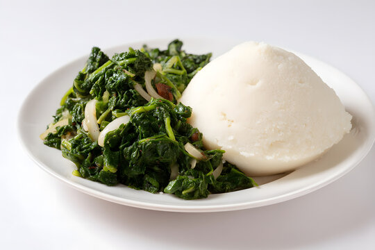 Classic Kenyan Dish Featuring Ugali Served with Fresh Sukuma Wiki on a Clean Plate