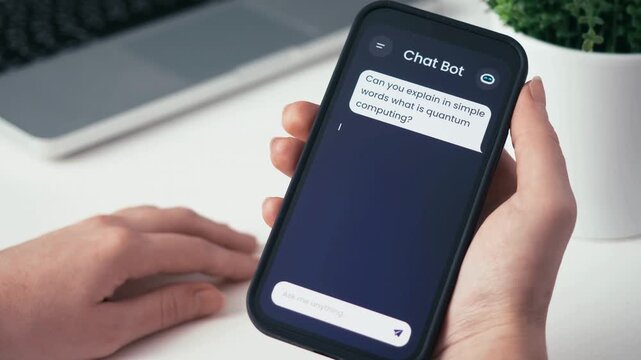 Person Using AI Chat Bot Application on Smartphone for Quantum Computing Information