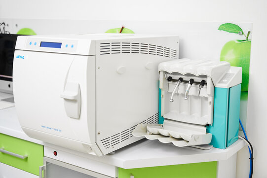 MELAG Vacuklav 23 sterilizer and dental unit in clinic. Concept of instrument sterilization