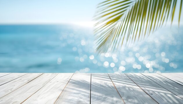 Wooden table with palm leaf shadow and blue sea background