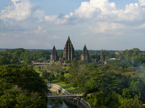 Aerial view of Prambanan Temple, the ancient Hindu temple complex with towering stone spires and lush tropical greenery in Kecamatan Prambanan, Daerah Istimewa Yogyakarta, Indonesia.