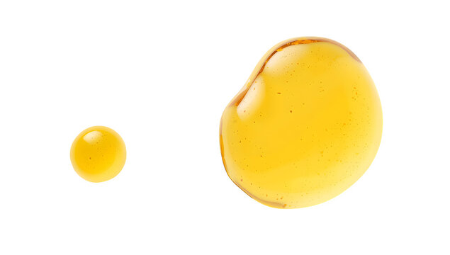 Yellow gel drops on black background, shiny