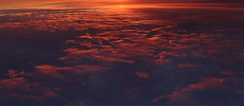 High resolution sunset over red stratus cloud. Epic cloudscape highlighted red and gold by setting sun, flipped image.