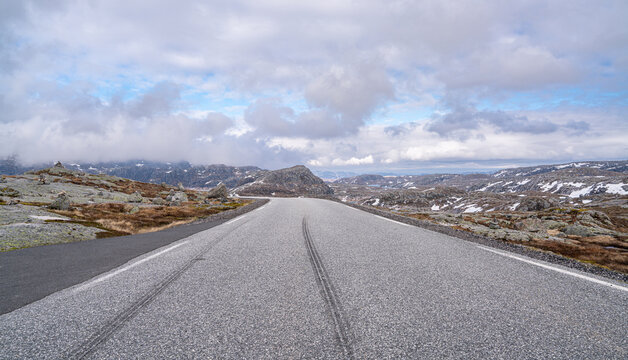 Scenic mountain road on Lysevegen near Kjerag and Lysebotn in Norway under dramatic cloudy sky