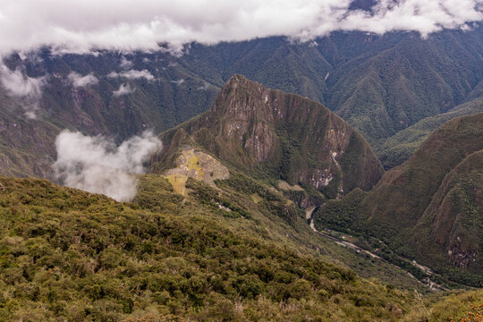Aerial view of Machu Picchu ruins and Urubamba river valley from Machu Picchu mountain, Peru