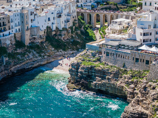 Aerial drone panorama view of Polignano a Mare with Lama Monachile beach, stunning Adriatic sea coastal townscape in Puglia, southern Italy © Audrius