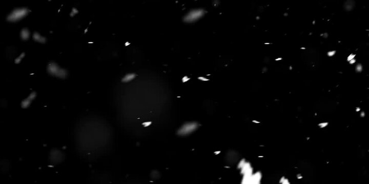 Snow Falling Effect. Small and large snowflakes moving on black background with alpha channel. Snowfall in winter weather. Design for video overlay. Realistic graphic 3D animated footage