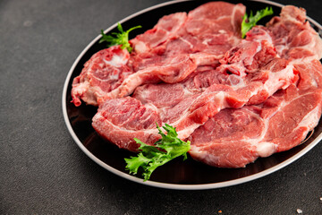 Fototapeta premium Raw pork steak pork tenderloin, food preparation lunch or dinner tasty organic snack fresh farm product delicious gourmet food background on the table rustic food, top view copy space
