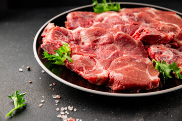 Fototapeta premium Raw pork steak pork tenderloin, food preparation lunch or dinner tasty organic snack fresh farm product delicious gourmet food background on the table rustic food, top view copy space