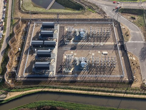 Aerial Drone View of High Voltage Power Transformer at Electrical Substation