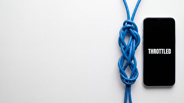 Smartphone with throttled screen text next to knotted blue ethernet cable. Internet restriction and network connection trouble. Communication blockade and data speed limit concept.