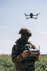 Ukrainian soldier flying reconnaissance drone for surveillance operation © Dmytro