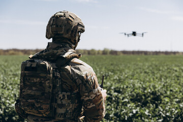 Fototapeta premium Ukrainian military pilot operating surveillance drone in field