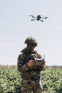 Ukrainian soldier flying reconnaissance drone in field