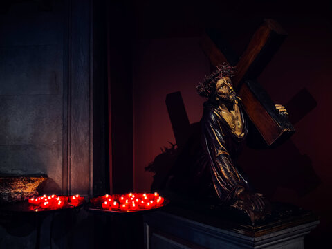 Religious Statue of Jesus with Candles in Lisbon Church