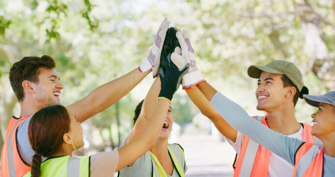 Volunteer, group and high five with celebration at park for goal, support or stop pollution in summer. People, team building and happy for social responsibility, success or excited for sustainability