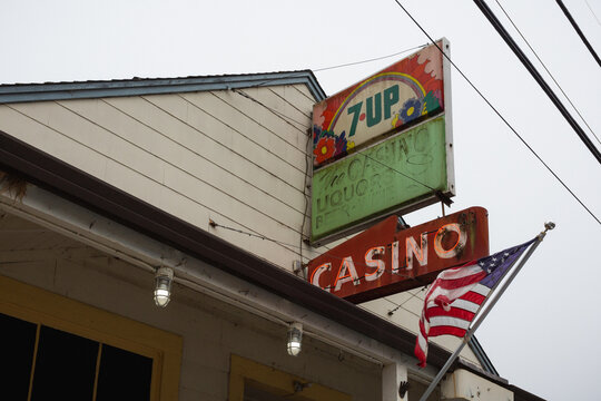 Vintage 7-Up sign and casino neon sign in Bodega Bay, California, October 2019