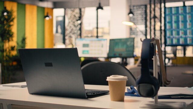Empty business office, work environment with supplies, modern furniture and natural light, Executive office, comfortable desk setup, stationery and laptop, corporate open plan.