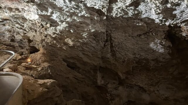 A candle on a rope in Zbra&scaron;ovsk&eacute; aragonitov&eacute; jeskyně demonstrates high carbon dioxide levels