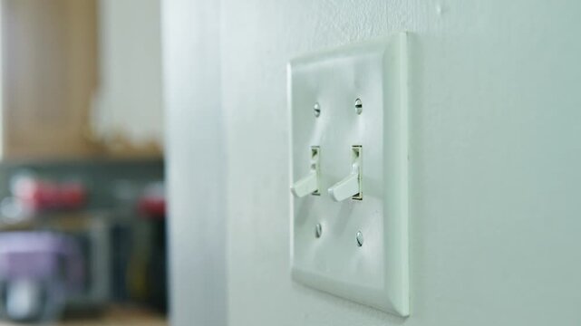 Flipping the switch as light illuminates the cozy kitchen at dusk
