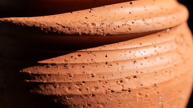 Closeup Macro Shot of Textured Terracotta Pottery Surface with Bubbles.
