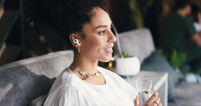 Drinking water, relax and music with woman in drip lounge for health, hydration or wellness. Beverage, earphones and thinking with person on iv for infusion of antioxidants, minerals or vitamins