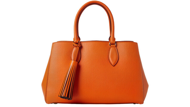 Isolated elegant orange leather handbag with top handle and decorative tassel, fashion accessory.