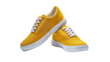 Naklejka premium Isolated pair of bright yellow canvas sneakers with white laces, stacked casually