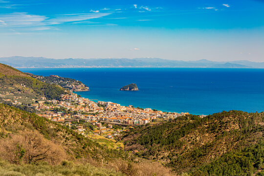 Aerial panoramic view of the coast of Spotorno, Bergeggi Island, Torre del Mare, Liguria, province of Savona, Italy. Riviera dei Fiori. Western Riviera. Ligurian Sea