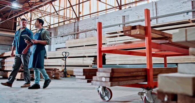 Wood, team and tablet with men in warehouse for carpenter, furniture and discussion. Manufacturing, timber production and woodworking partner with people for online checklist and floor supervisor