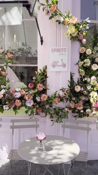 Vertical 4K Editorial Moving Shot Of Peggy Porschen Famous Pink Facade Description: LONDON, UNITED KINGDOM - MAY, 2026, 7:15 pm, Ebury Street