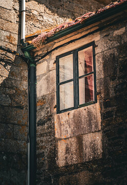 Old window on a stone house in Melide, Galicia, Spain
