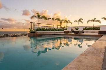 Fototapeta premium Sunset over the pool in the caribbean