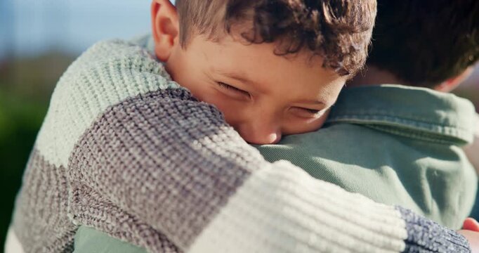 Love, hug and child with dad in garden for bonding, loving relationship and security for development. Family, outdoor and boy with father in embrace for affection, support and connection for trust