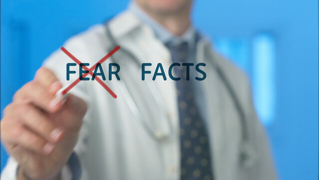 Doctor's hand crossing out fear and highlighting facts on a transparent screen, symbolizing a shift towards evidence based information and knowledge in healthcare to combat misinformation