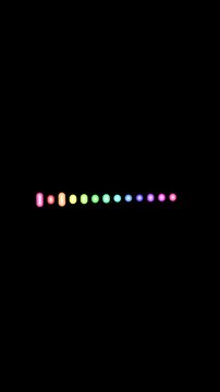 Neon dots create a colorful spectrum. Neon dots glow on black. These neon dots and bars provide a minimal abstract light background for modern technology and creative video design.