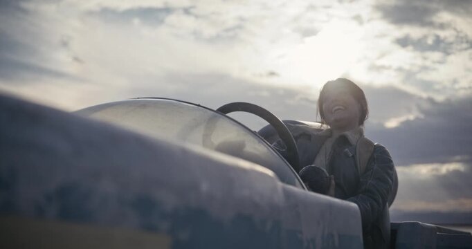 Low, cinematic silhouette of woman driving in sci-fi vehicle