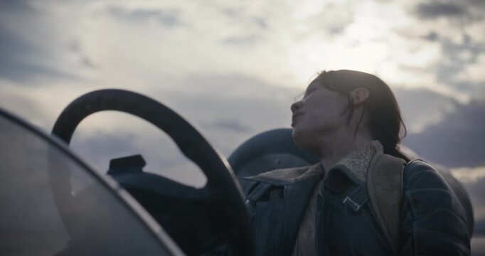 Cinematic silhouette of woman driving sci-fi vehicle and talking to someone off screen