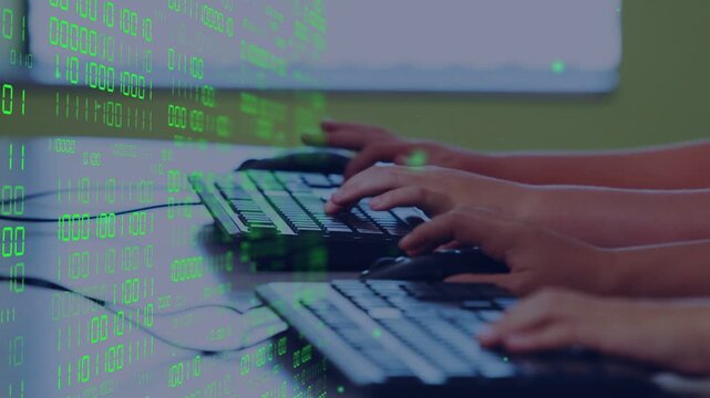 Students starting typing on keyboards, clicking mouse on cue, practicing coding with binary overlay