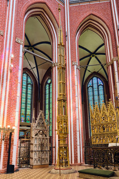 Bad Doberan, Germany - 19 July 2025: View of the ornate golden sacrament house and Gothic brick architecture inside the Doberaner Munster.