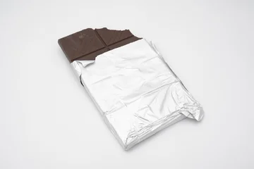 Unwrapped chocolate bar shows brown core © jr-art