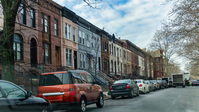 New York, US, 15 January 2015 Row Houses and Parked Cars Along an Urban Residential Street