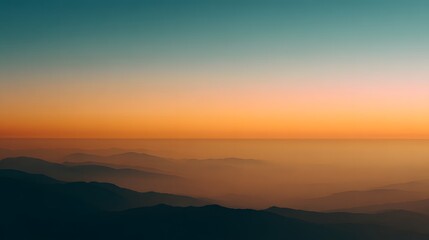 Fototapeta premium Breathtaking panoramic view of layered mountain ranges du a vibrant sunset with colorful sky and serene atmosphere