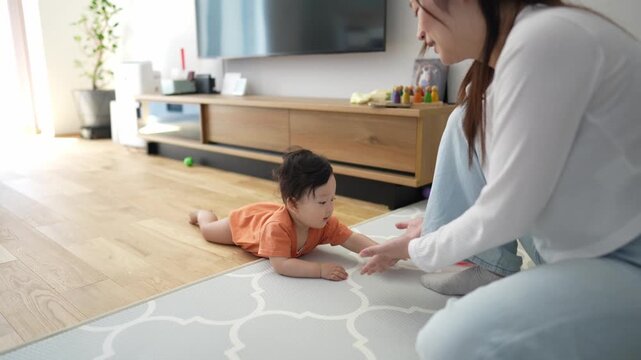 Soft light fills cozy living room. Child crawls on patterned rug with focused curiosity. Parent kneels close, offering gentle encouragement. Warm interaction evokes nurturing, loving moments