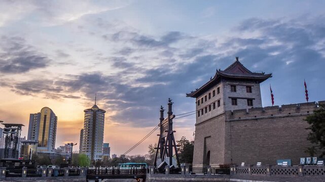 Xi'an City Wall Gate and Modern Skyline at Sunset in Xi an City Wall, Xi an, China