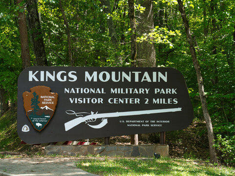 KINGS MOUNTAIN, SOUTH CAROLINA - MAY 14, 2022: The official welcome sign for the Kings Mountain National Military Park visitor center, featuring the National Park Service arrowhead logo.