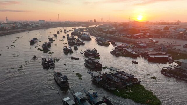 Aerial view of Cai Rang floating market. CaiRang is famous market in mekong delta, Can Tho, Vietnam. Tourists, people buy and sell food, vegetable, fruits on boat, ship. The vibrant scene, crowded