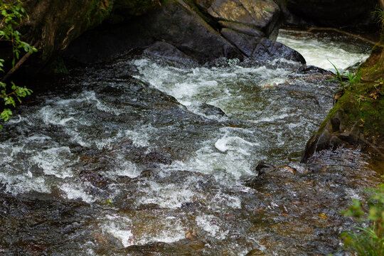 image that represents a stream that flows strongly and cleanses the body and is a symbol of renewal.