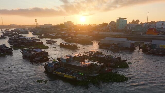 Aerial view of Cai Rang floating market. CaiRang is famous market in mekong delta, Can Tho, Vietnam. Tourists, people buy and sell food, vegetable, fruits on boat, ship. The vibrant scene, crowded
